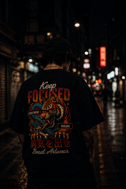 Black streetwear t-shirt with tiger and dragon graphic, 'Keep Focused' text, and Japanese characters on back, worn in neon-lit alley.